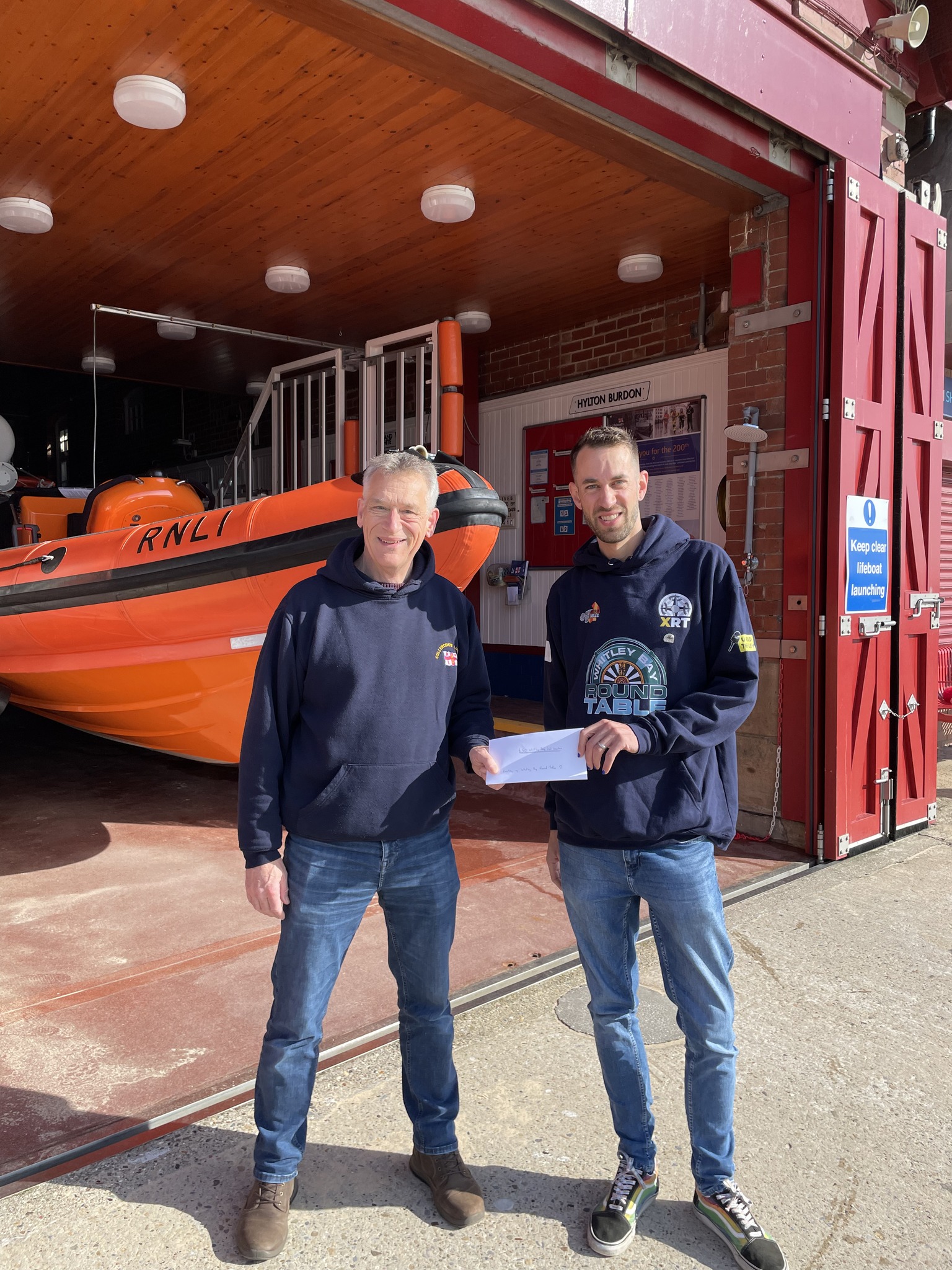 Presenting a cheque to RNLI